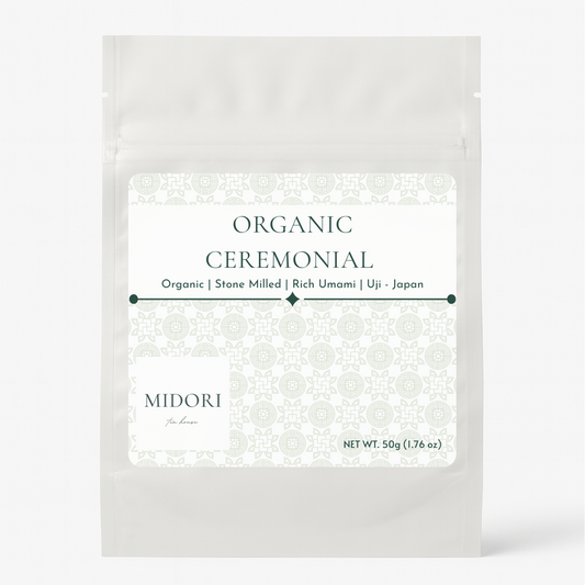 White packaging of Organic Ceremonial Midori on a white background